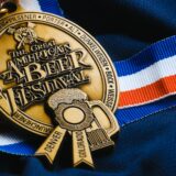 a gold medal with a ribbon around it